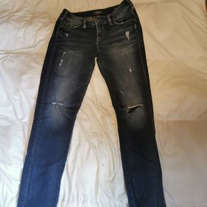 Low rise distressed skinny jeans